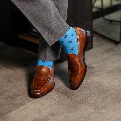 The Penchins - A Sky Blue Sock with Black Horseshoes