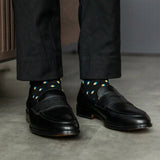 A Black Sock Gentleman's Sock with a Peach, Sky Blue, and White Gemstone Pattern