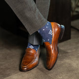  A Prussian blue sock with a crisp white nested diamond pattern, designed to bring timeless sophistication with a modern edge.