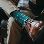 guy wearing khaki slacks, green socks, with brown dress shoes