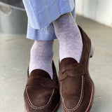 Guy wearing light grey men's dress socks with baby blue pin dot pattern