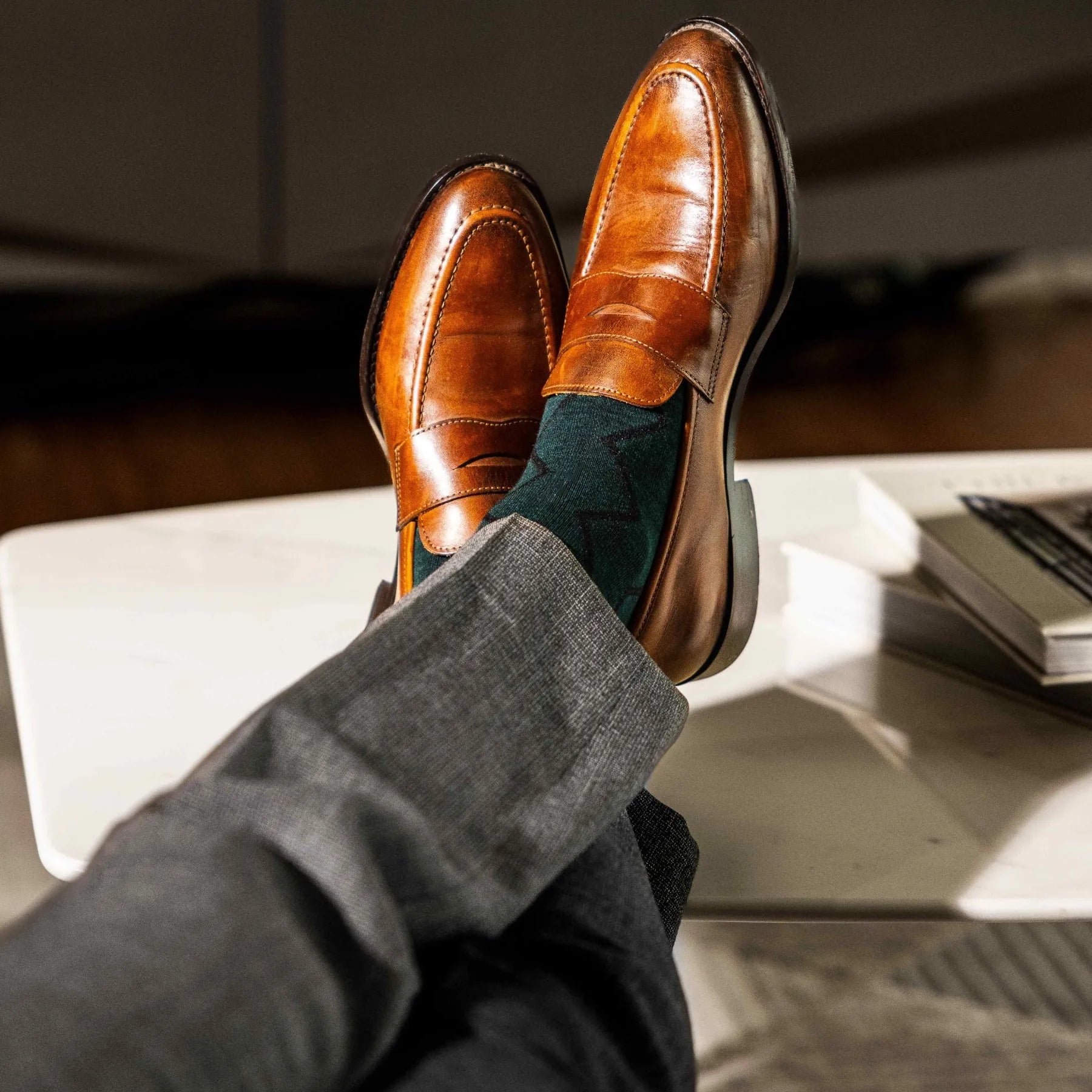 Deep green men's dress socks with black zigzag pattern