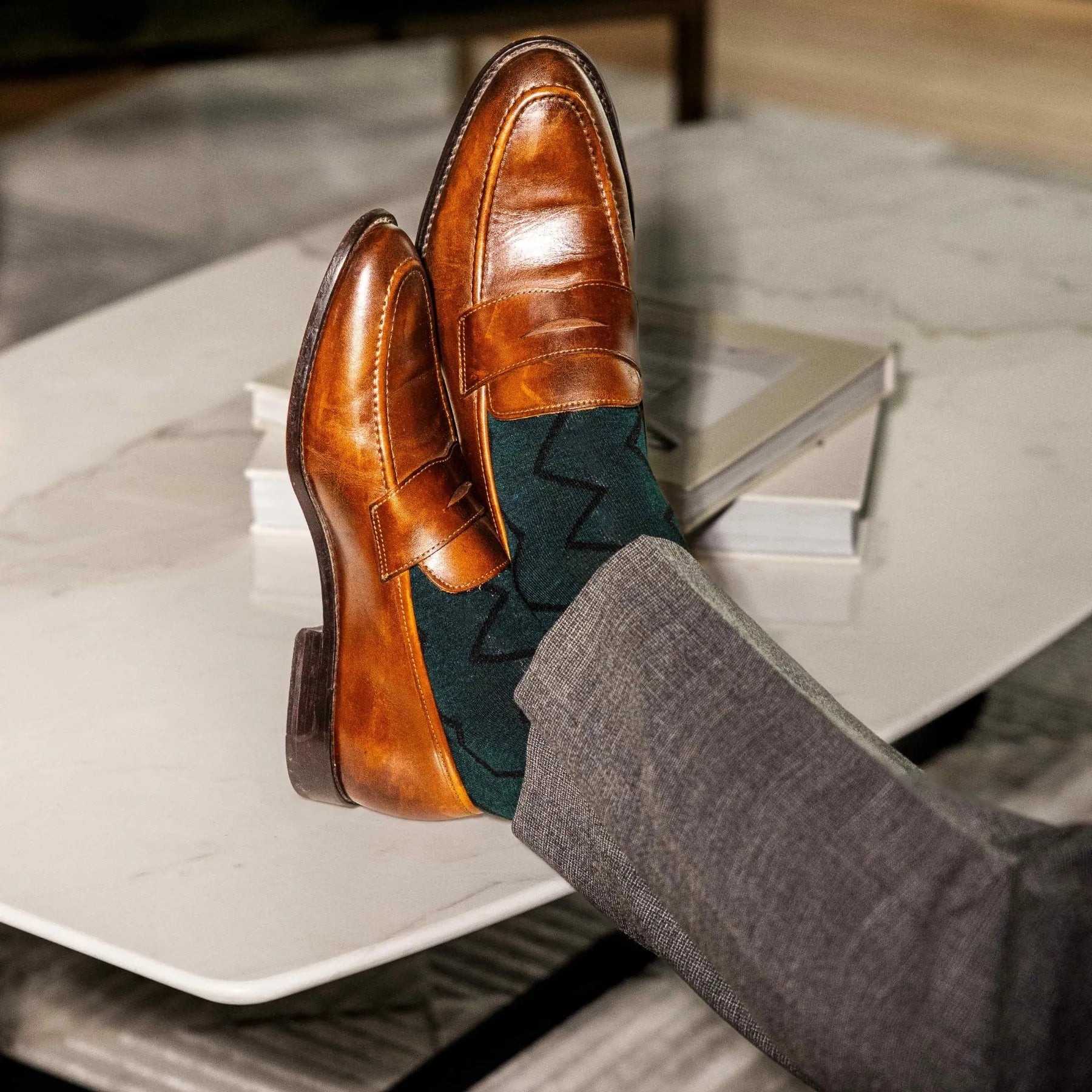 Deep green men's dress socks with black zigzag pattern