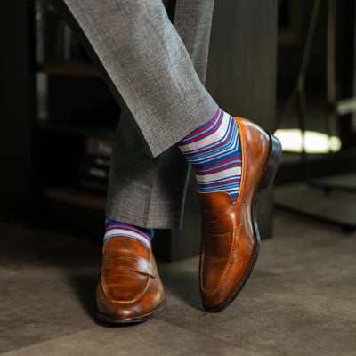 The Whitakers - A Blue, Red and White Striped Sock