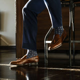 dark blue men's dress socks with light blue and white x pattern