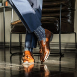dark blue men's dress socks with light blue and white x pattern