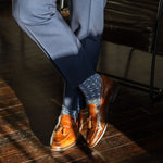 dark blue men's dress socks with light blue and white x pattern