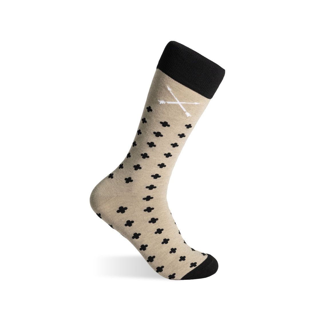 Gold crew sock with black rounded hatch pattern, contrasting cuff and embroidered logo.