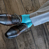 Turquoise blue men's dress sock with white contrasting diamond pattern