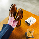 Heathered pink men's dress socks with a fuchsia flower pattern