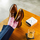 Heathered pink men's dress socks with a fuchsia flower pattern