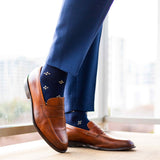 Navy men's dress socks with a gold flower pattern