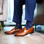 Navy men's dress socks with a gold flower pattern