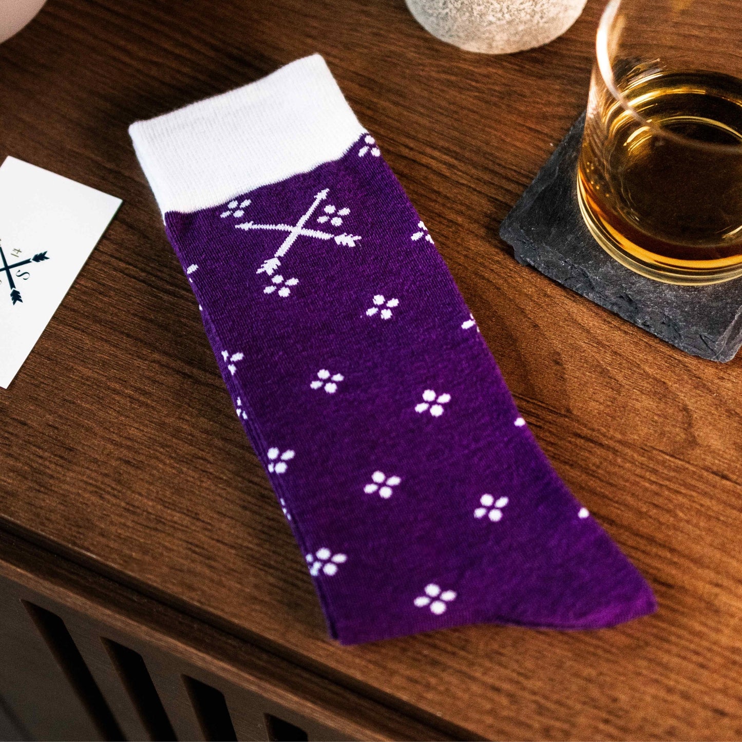 Purple men's dress sock with a white flower pattern