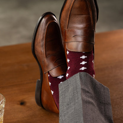 a deep red sock with a white hatch pattern