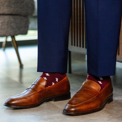 a deep red sock with a white hatch pattern