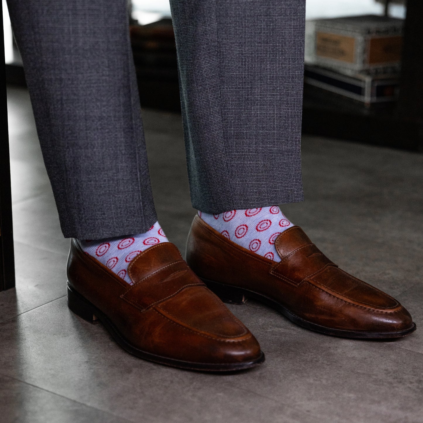 pale blue men's dress socks with a red double dot pattern