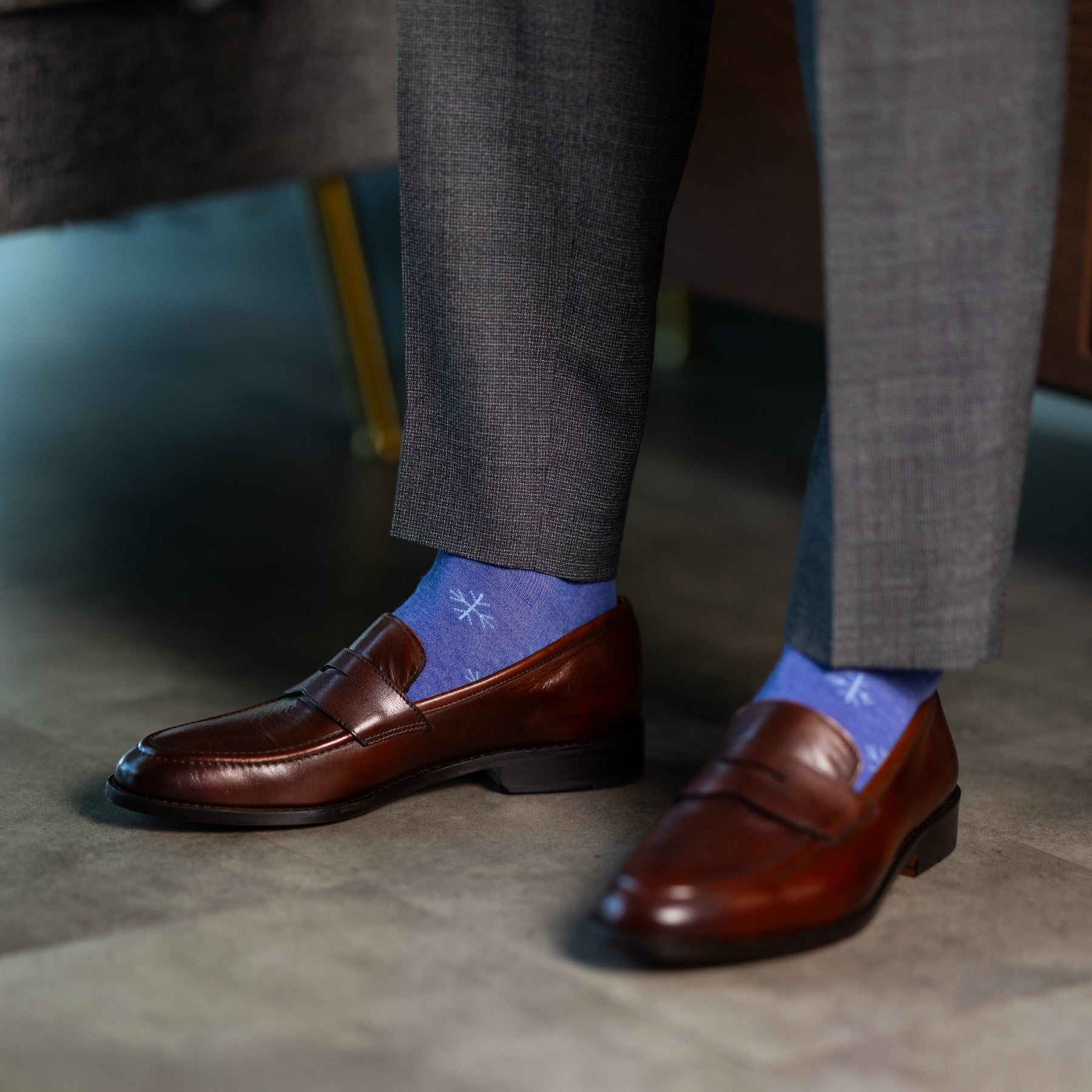 A Heathered Blue men's dress sock with a light blue snowflake pattern