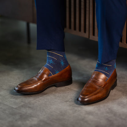 Prussian Blue men's dress socks with sky blue and gold constellation and stripe patterns.