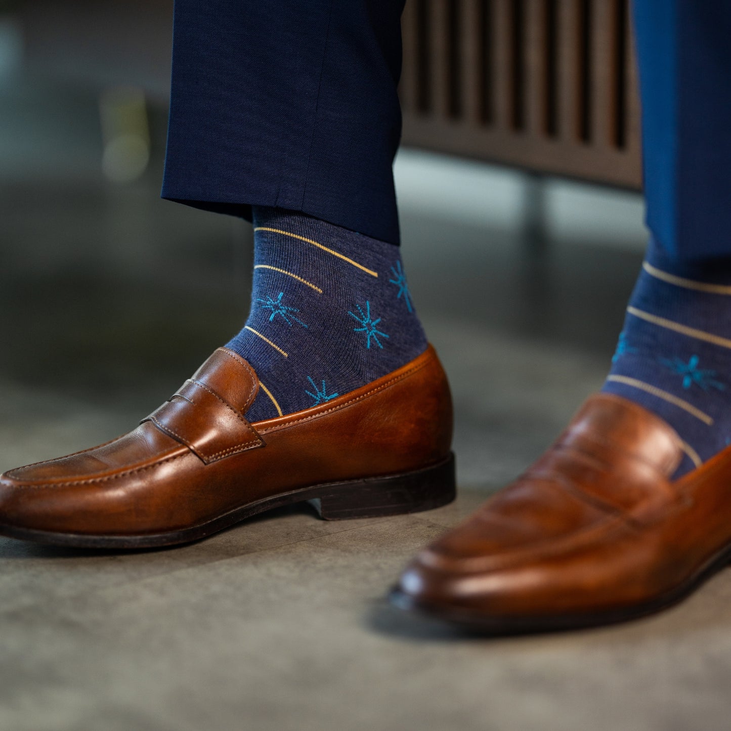 Prussian Blue men's dress socks with sky blue and gold constellation and stripe patterns.