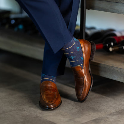 Prussian Blue men's dress socks with sky blue and gold constellation and stripe patterns.