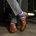 A blue, red, and grey striped men's dress sock