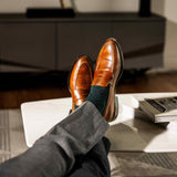 Deep green men's dress socks with black zigzag pattern