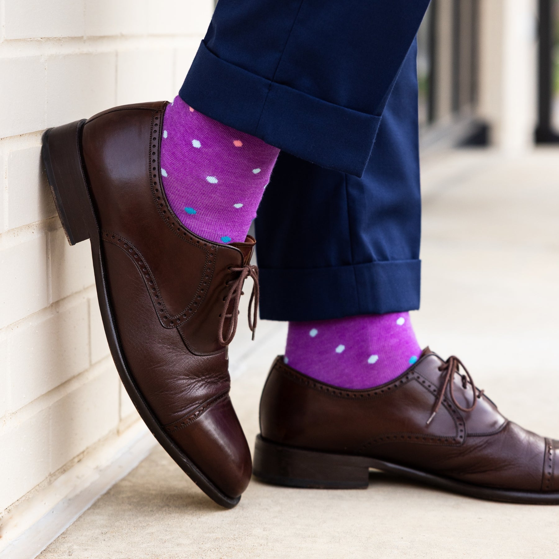 vibrant purple men's dress socks with multi-colored polka dot pattern