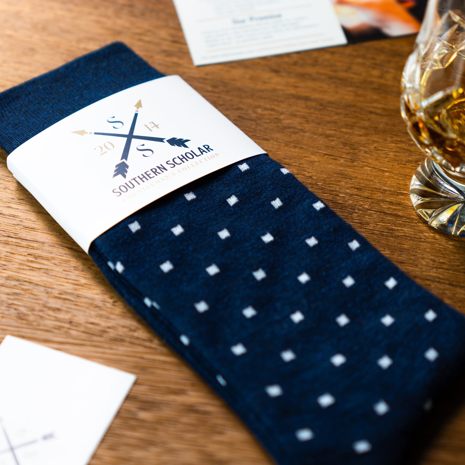Navy blue men's patterned dress socks with white dots