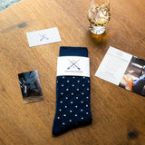 Navy blue men's patterned dress socks with white dots
