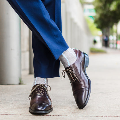 Light grey men's dress socks with an arctic blue vertical stripe pattern