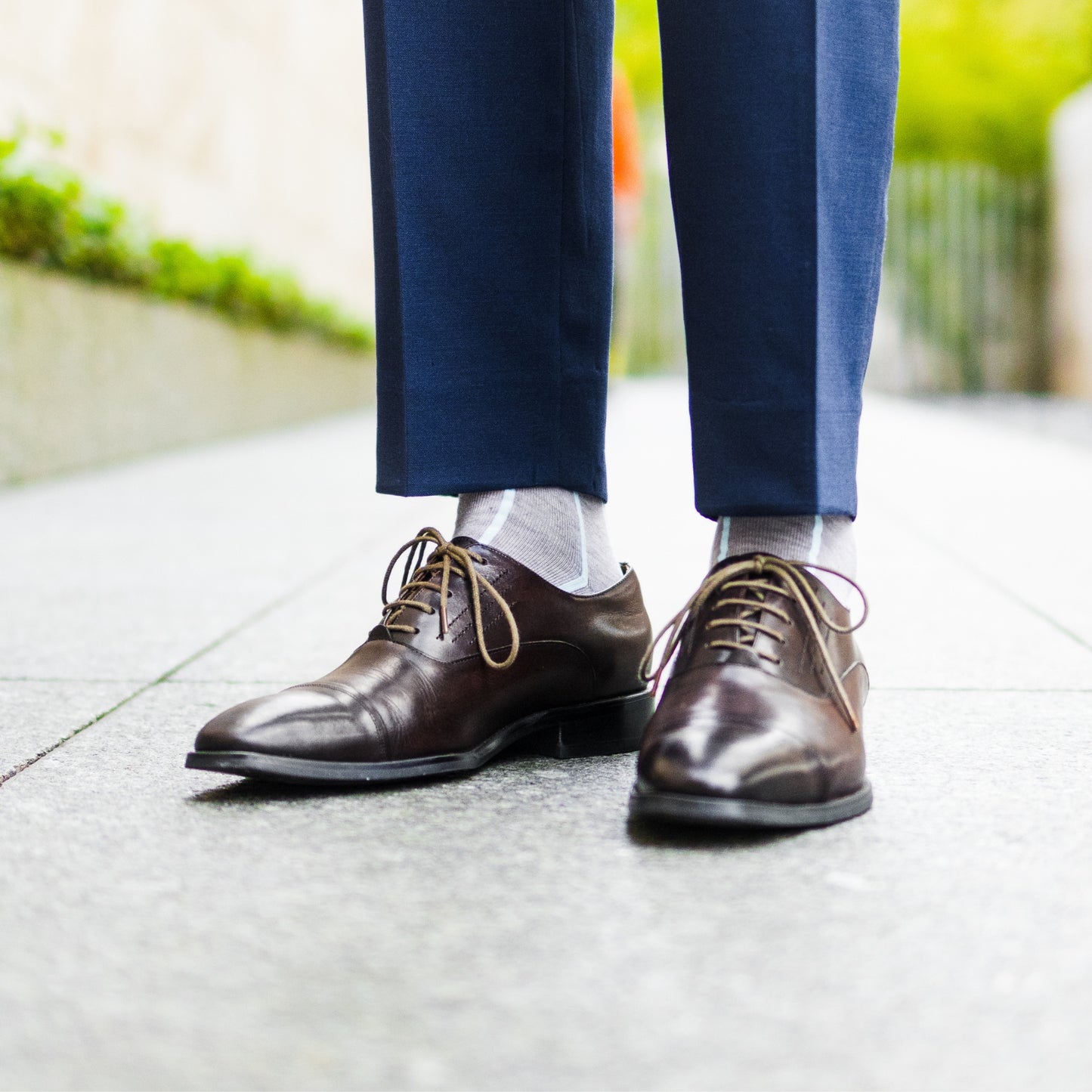 Light grey men's dress socks with an arctic blue vertical stripe pattern