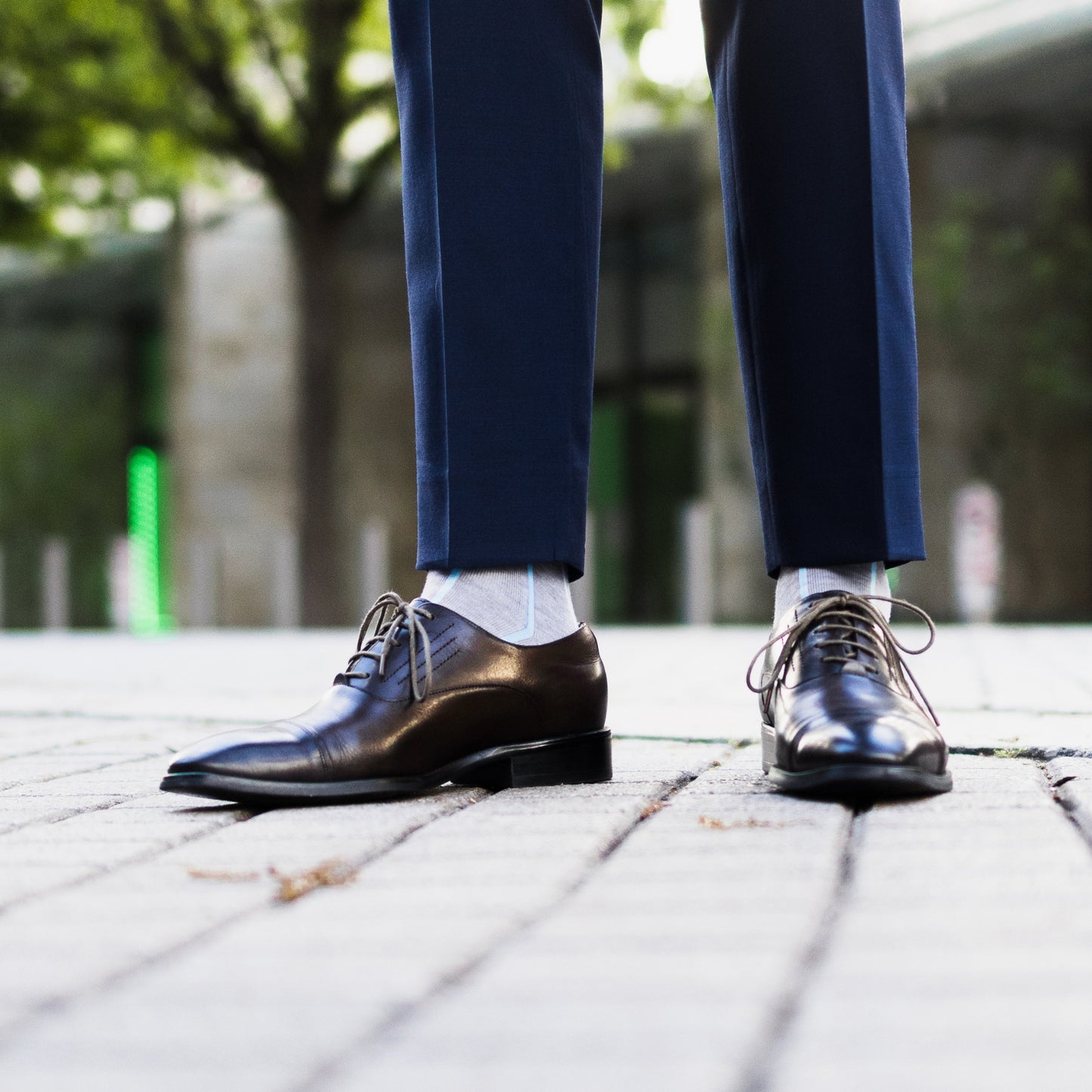 Light grey men's dress socks with an arctic blue vertical stripe pattern