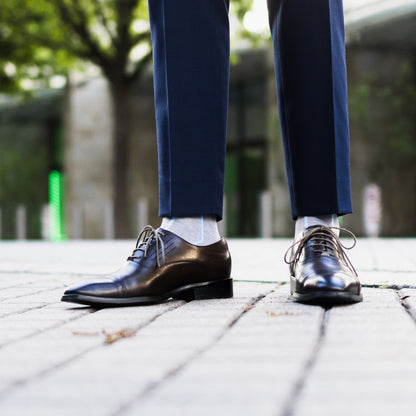 Light grey men's dress socks with an arctic blue vertical stripe pattern