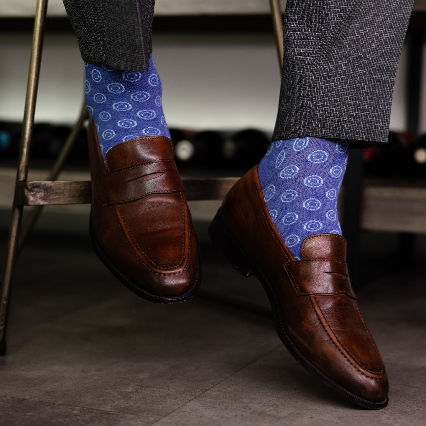 A heathered blue sock with light blue double dots
