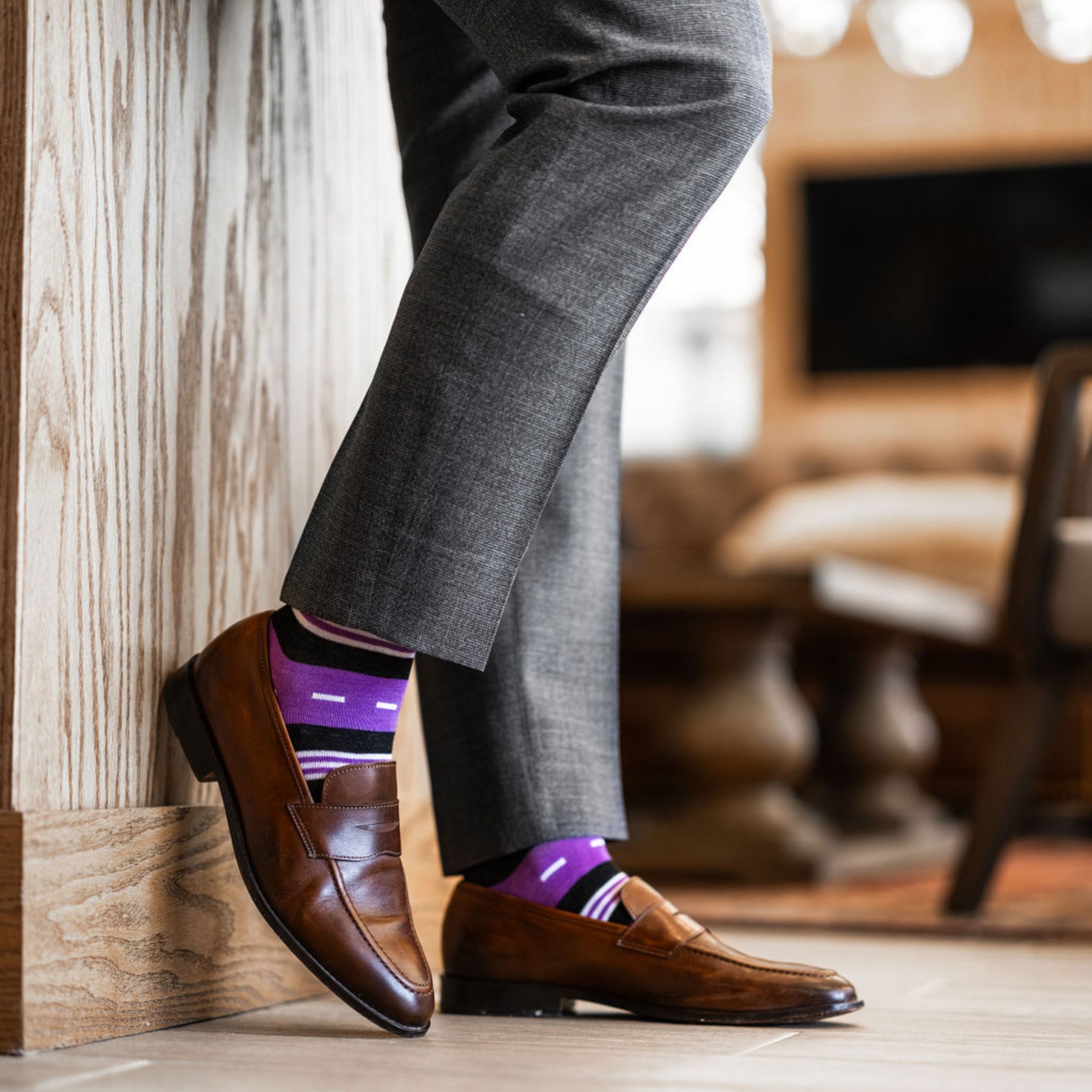 Vibrant purple men's dress sock with unique white and black stripe pattern