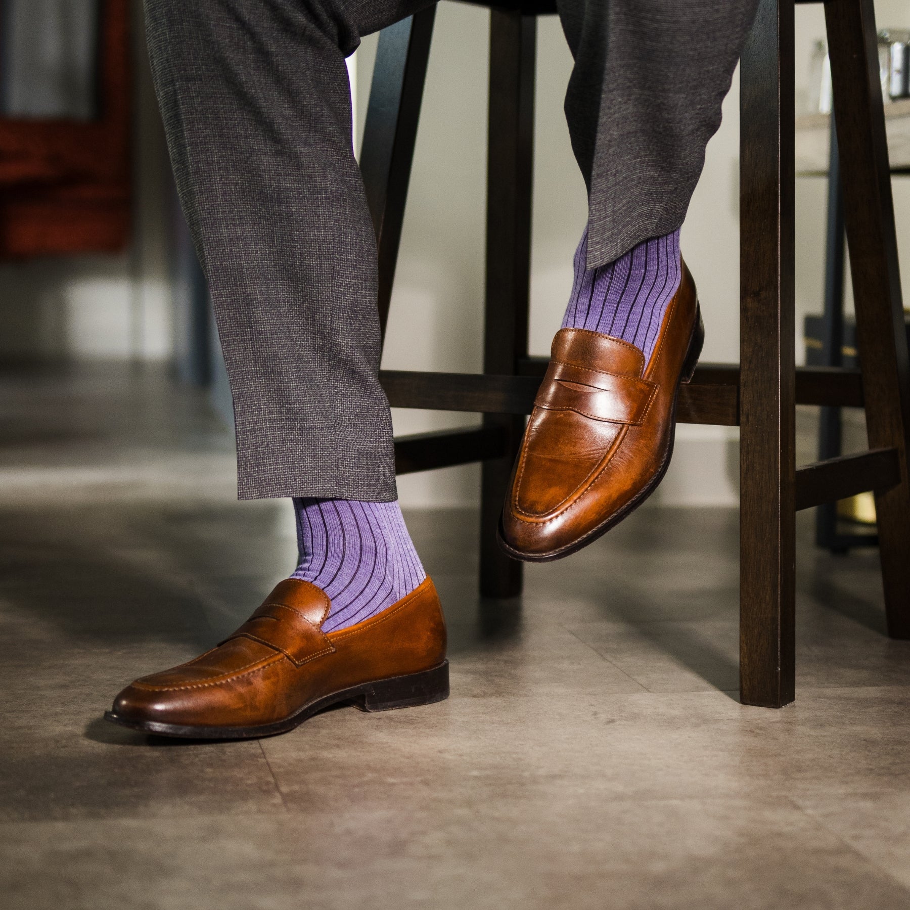 A lavender men's dress sock with a dark violet ribbed pattern