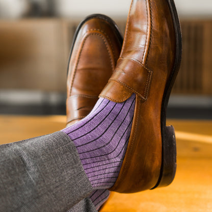 A lavender men's dress sock with a dark violet ribbed pattern