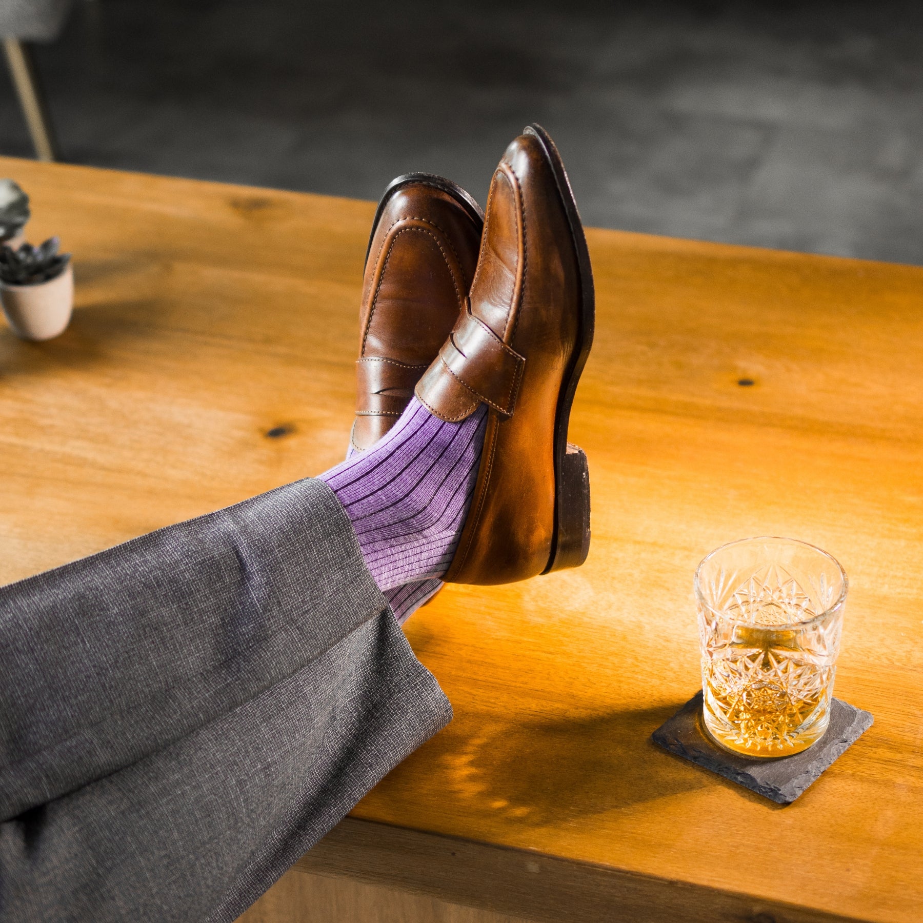 A lavender men's dress sock with a dark violet ribbed pattern