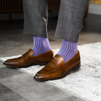 A lavender men's dress sock with a dark violet ribbed pattern