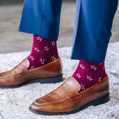 Deep red sock with a contrasting white firework pattern