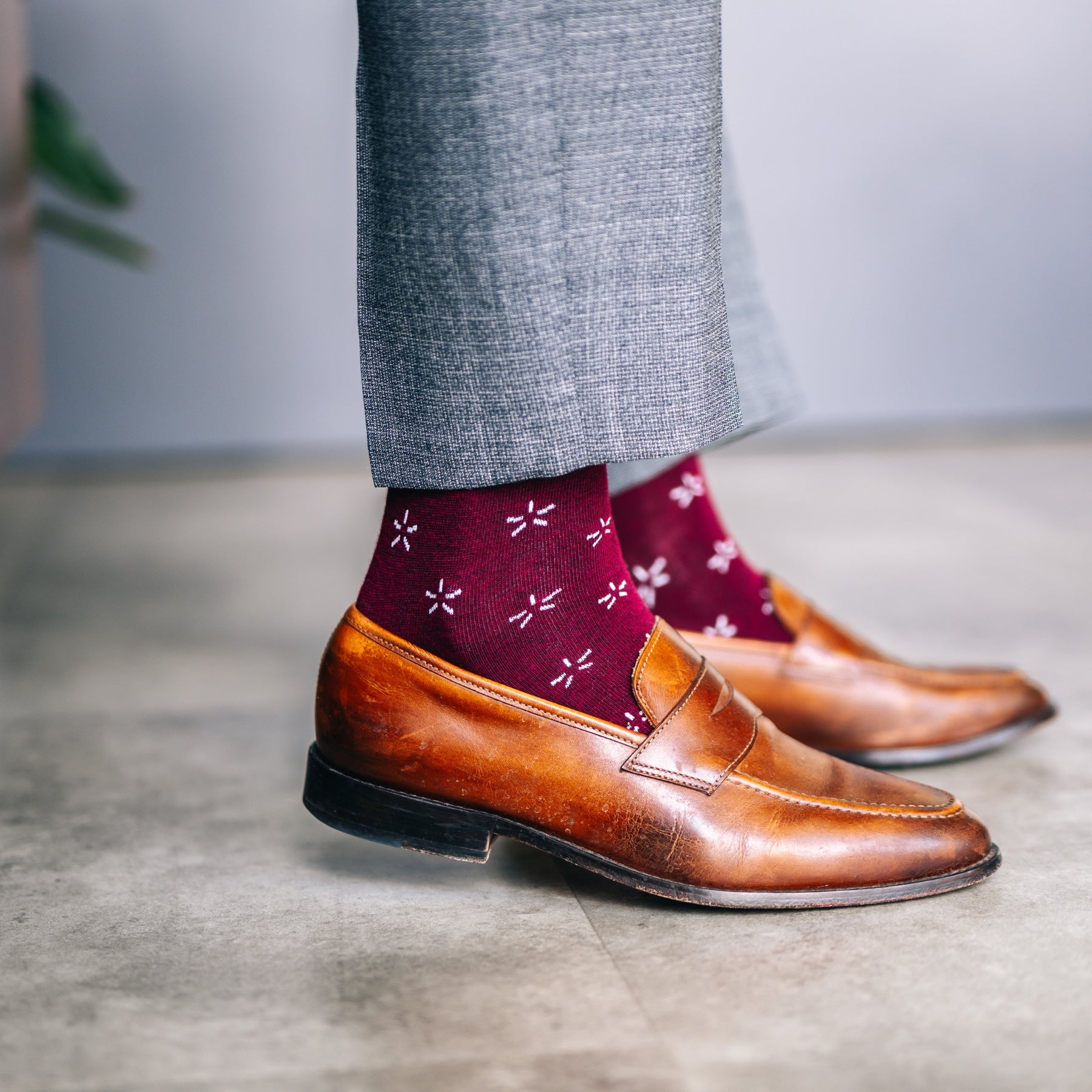 Deep red sock with a contrasting white firework pattern