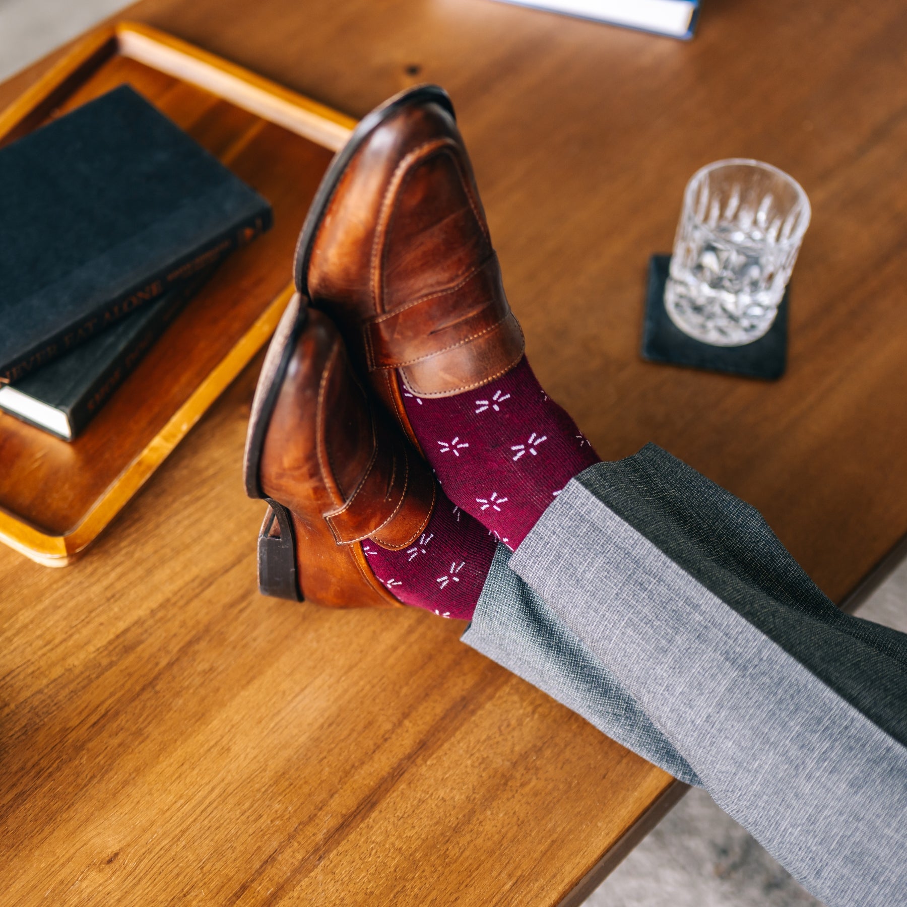 Deep red sock with a contrasting white firework pattern