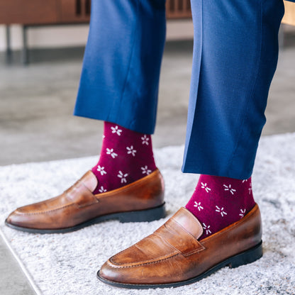 Deep red sock with a contrasting white firework pattern