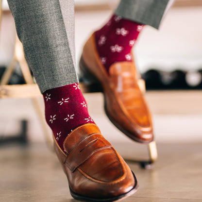 Deep red sock with a contrasting white firework pattern