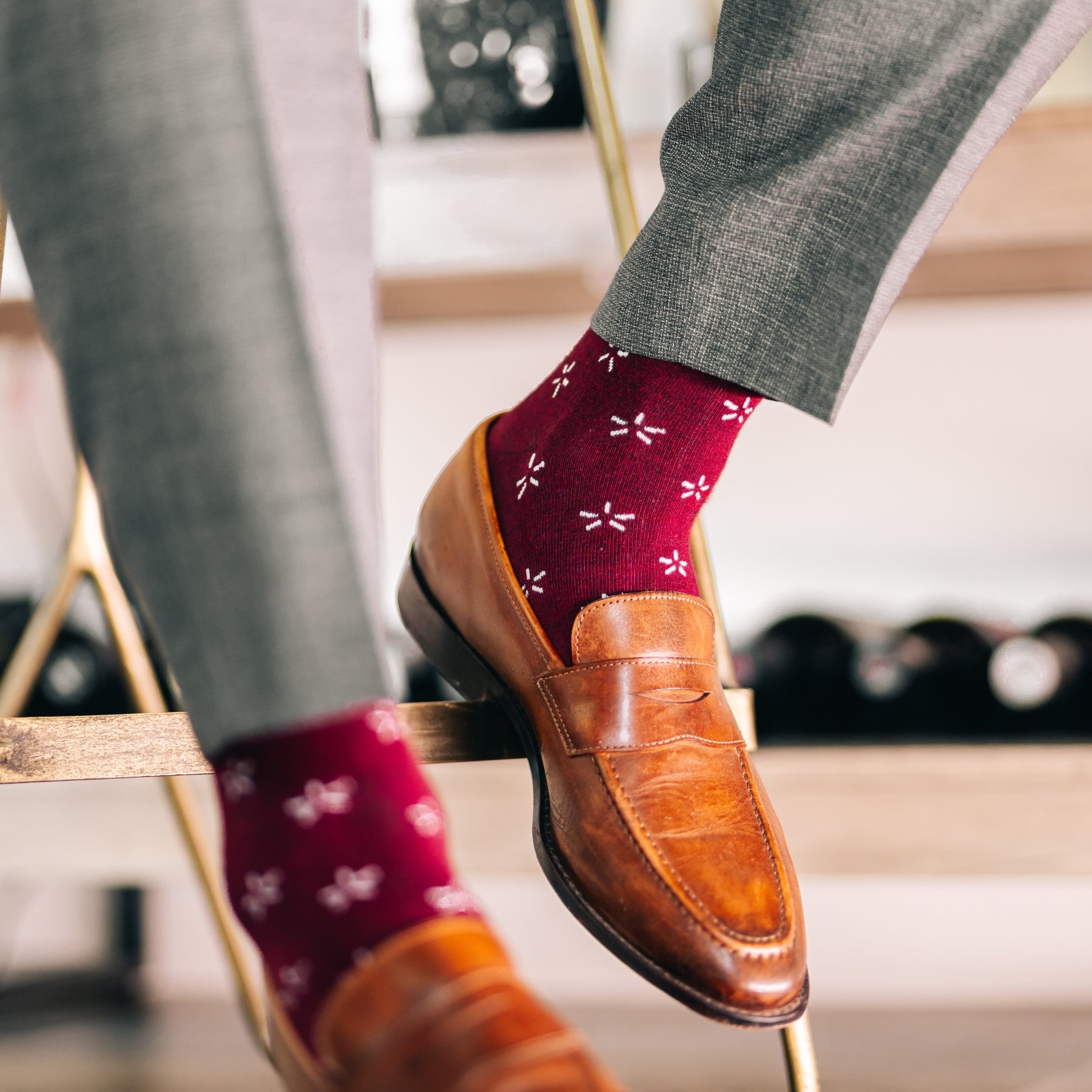 Deep red sock with a contrasting white firework pattern