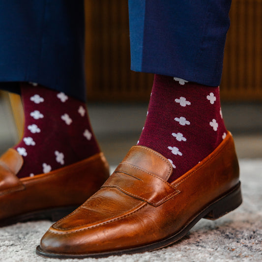 a deep red sock with a white hatch pattern