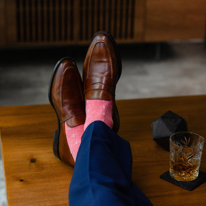 coral men's dress socks with a light blue t-sun pattern