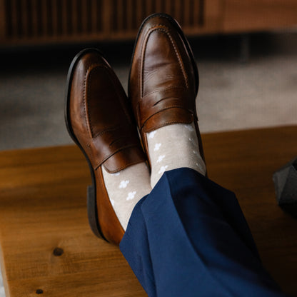 a sand men's dress sock with white hatches