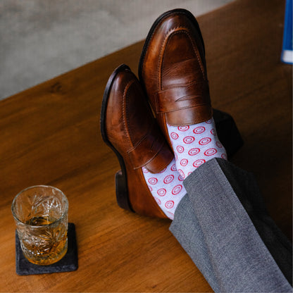 pale blue men's dress socks with a red double dot pattern